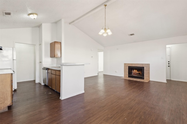 kitchen with visible vents, light countertops, dark wood finished floors, and freestanding refrigerator