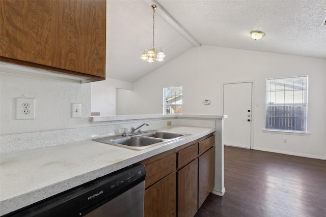 kitchen featuring a wealth of natural light, light countertops, dishwasher, and a sink