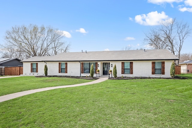 single story home with fence, a front lawn, and brick siding