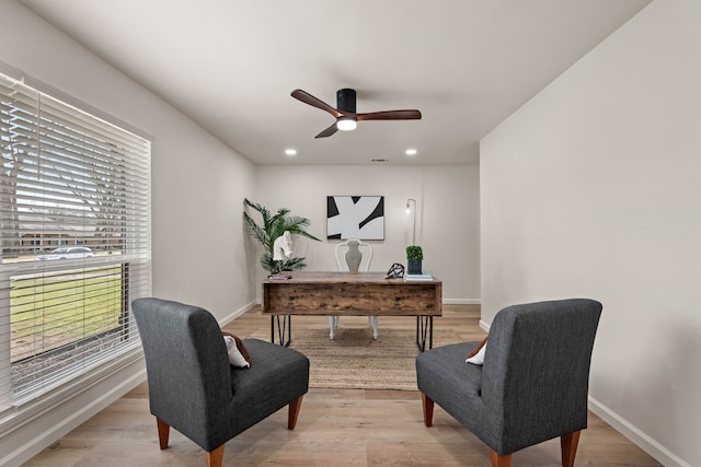 office featuring light wood finished floors, recessed lighting, and baseboards