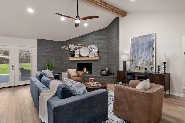 living room with french doors, a brick fireplace, wood finished floors, high vaulted ceiling, and beamed ceiling