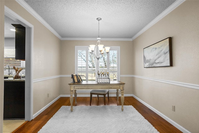 home office featuring an inviting chandelier, a textured ceiling, baseboards, and dark wood-type flooring