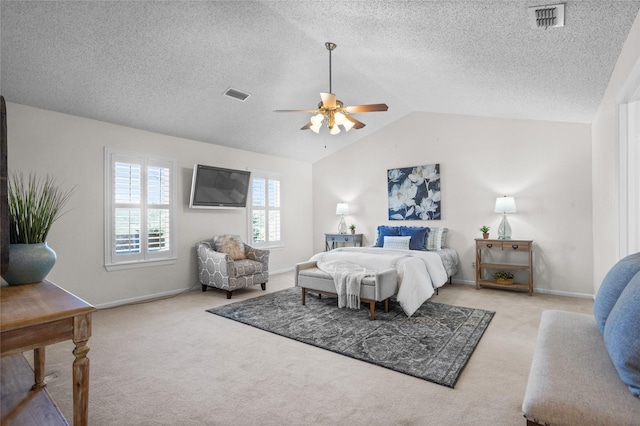 carpeted bedroom with lofted ceiling, ceiling fan, visible vents, and baseboards