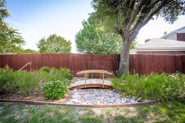 view of yard with a fenced backyard