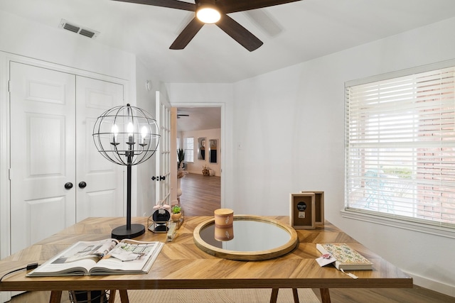 dining space with ceiling fan, plenty of natural light, and visible vents