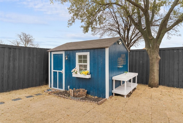 view of shed featuring a fenced backyard