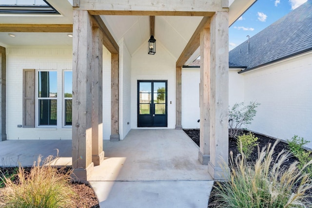 entrance to property with brick siding