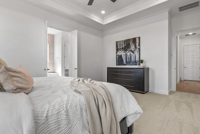 bedroom with visible vents, crown molding, light carpet, and baseboards