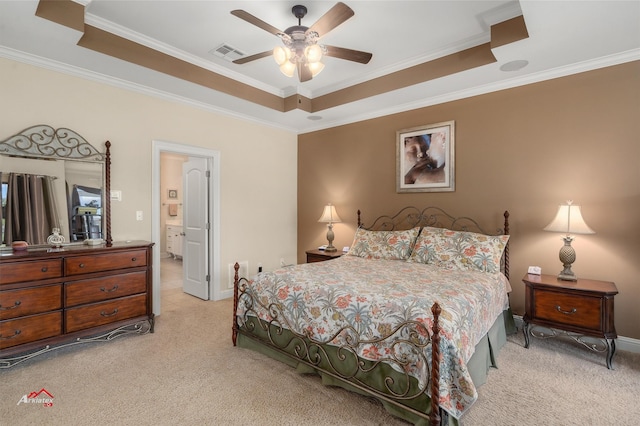 bedroom featuring a raised ceiling, visible vents, and light carpet