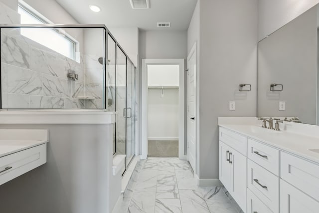 full bathroom with marble finish floor, vanity, visible vents, and a stall shower