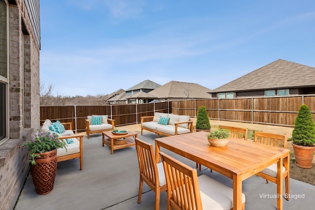 view of patio with a fenced backyard and outdoor lounge area