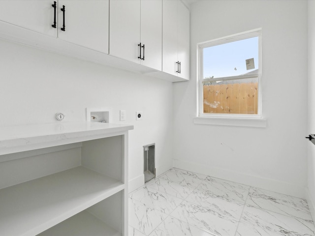 5809 Black Pine Cir, Granbury, TX 76048 - laundry room featuring cabinet space, electric dryer hookup, light marble finish flooring, hookup for a washing machine, and baseboards