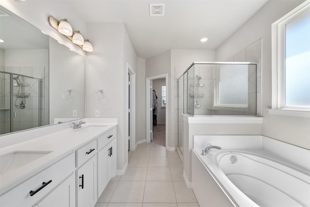 bathroom with tile patterned floors, visible vents, a stall shower, a sink, and a bath