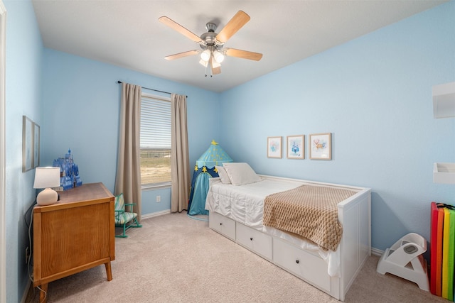 bedroom featuring ceiling fan, baseboards, and carpet floors