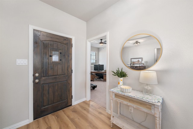 entrance foyer with light wood finished floors and baseboards