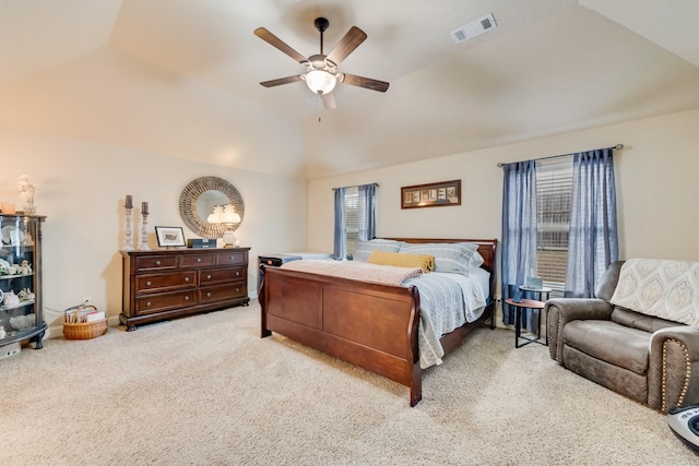 bedroom with lofted ceiling, a ceiling fan, visible vents, and carpet flooring