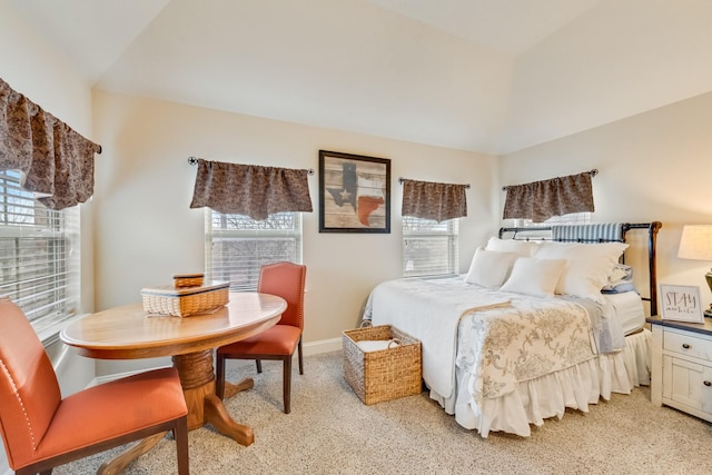 bedroom featuring baseboards and light colored carpet