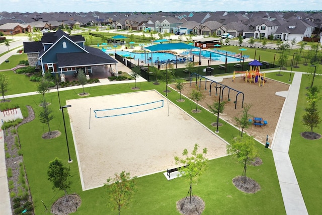 exterior space with a residential view, playground community, and volleyball court