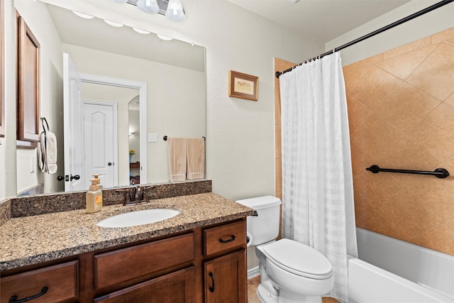 bathroom with toilet, shower / bath combo, and vanity