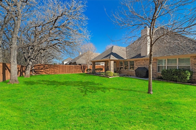 exterior space featuring a fenced backyard