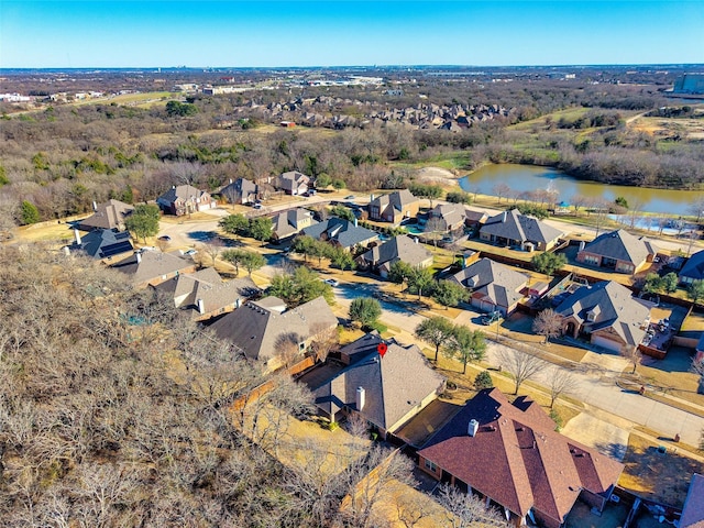 drone / aerial view with a water view and a residential view