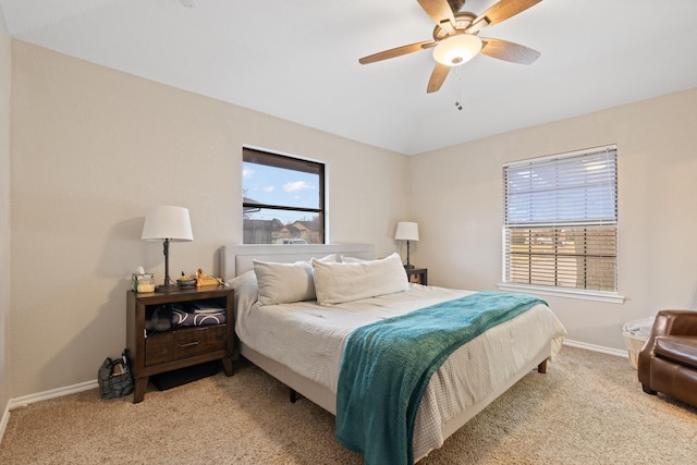 bedroom featuring carpet floors, ceiling fan, baseboards, and vaulted ceiling