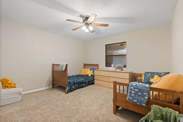 bedroom featuring carpet flooring, ceiling fan, and baseboards