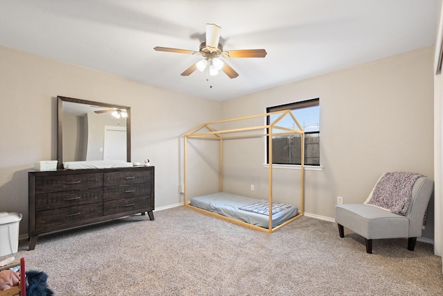 carpeted bedroom featuring ceiling fan and baseboards