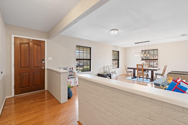 foyer entrance featuring light wood finished floors