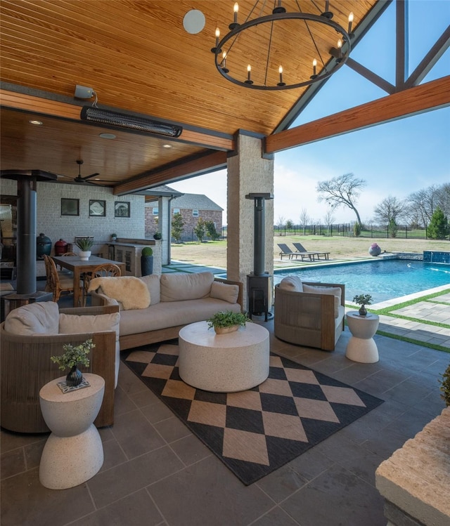 view of patio / terrace featuring outdoor dining space, outdoor lounge area, an outdoor pool, and ceiling fan