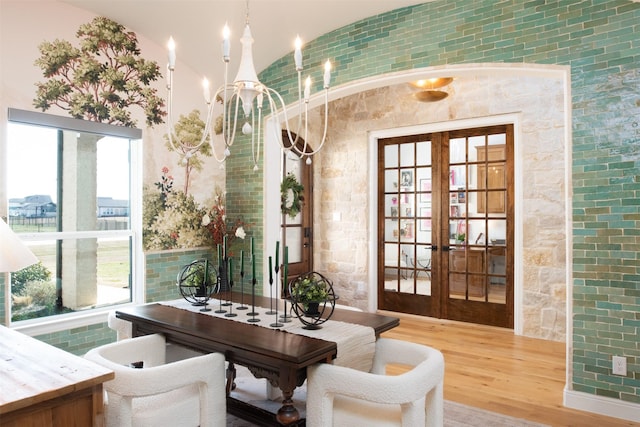 office area with a chandelier, wood finished floors, and french doors