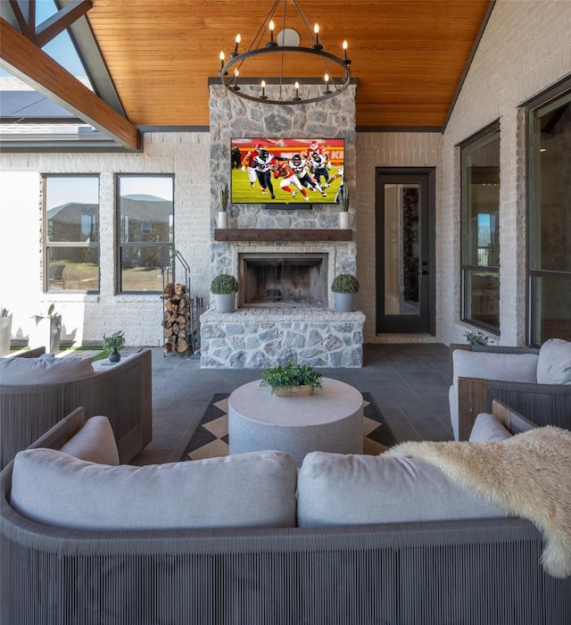 exterior space with an inviting chandelier, wood ceiling, an outdoor stone fireplace, and vaulted ceiling