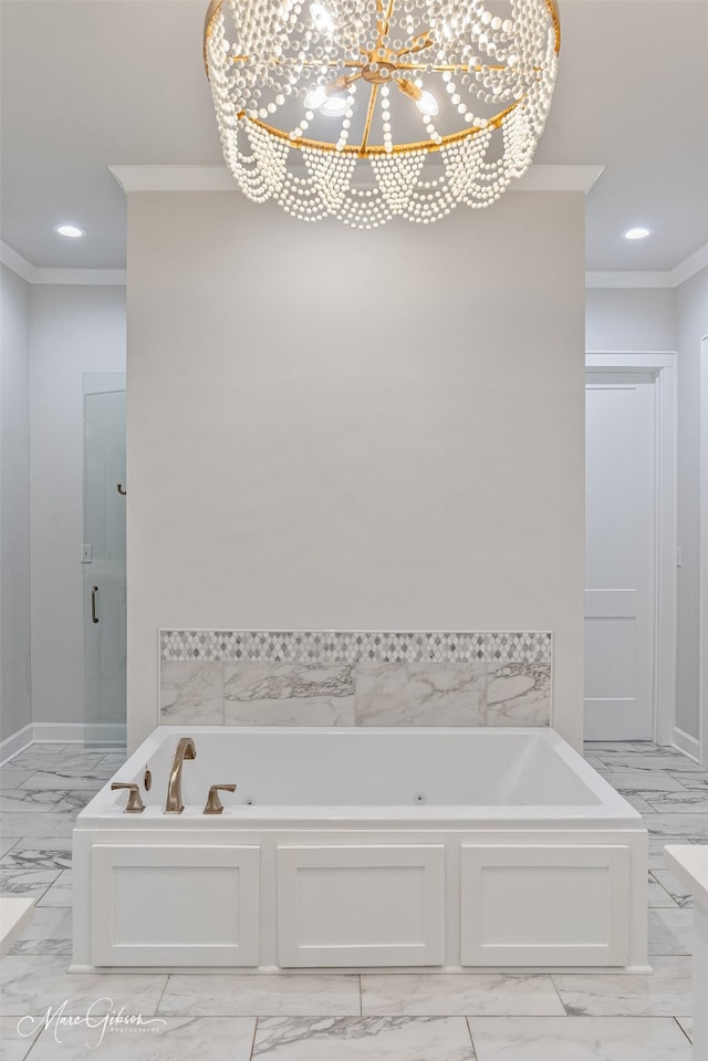 full bathroom with a chandelier, marble finish floor, crown molding, and a tub with jets