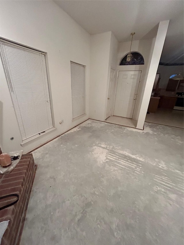 entrance foyer with unfinished concrete floors