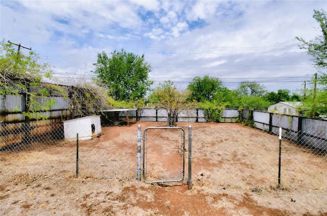 view of yard with a gate and fence