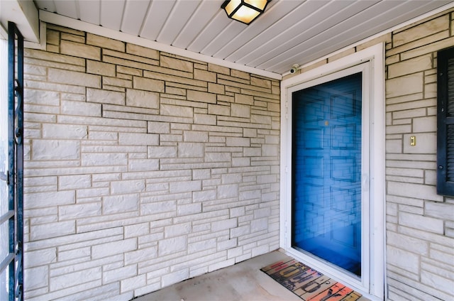 view of exterior entry with stone siding