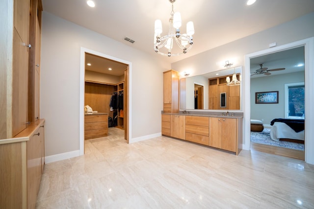 full bathroom featuring baseboards, visible vents, a walk in closet, vanity, and recessed lighting