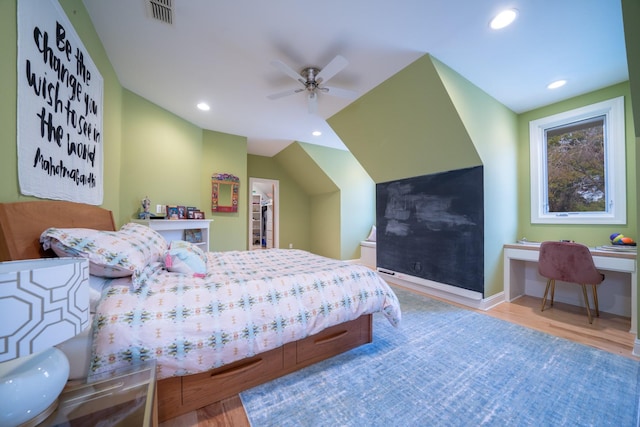 bedroom featuring visible vents, a walk in closet, wood finished floors, and recessed lighting