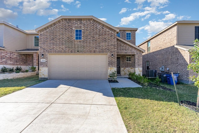 traditional-style house featuring brick siding, concrete driveway, stone siding, an attached garage, and a front yard