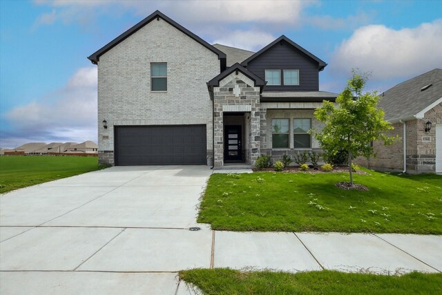 view of front facade featuring driveway, brick siding, an attached garage, stone siding, and a front lawn