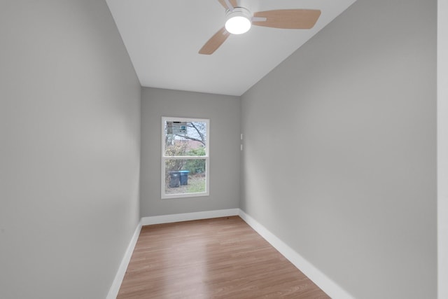 unfurnished room with light wood-style flooring, baseboards, and ceiling fan