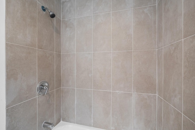 bathroom with shower / washtub combination