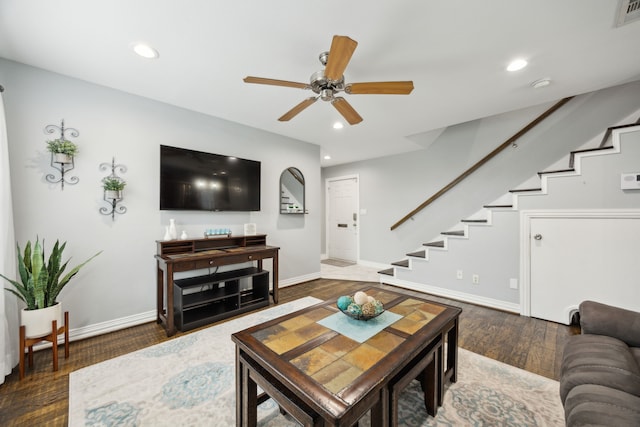 living area with dark wood-style flooring, stairway, and recessed lighting