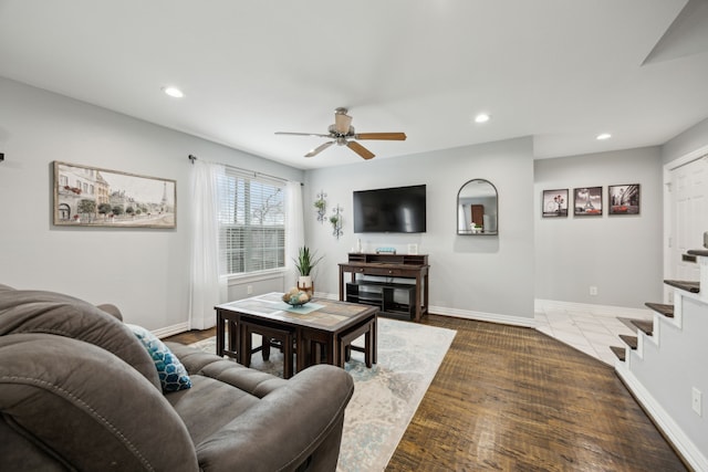 living room with recessed lighting, ceiling fan, baseboards, and stairs