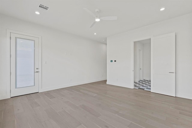 unfurnished room with recessed lighting, visible vents, ceiling fan, and light wood-style flooring