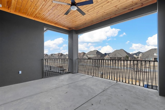 view of patio with ceiling fan and a residential view