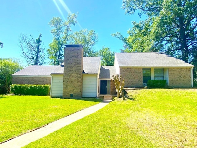 view of front facade featuring a chimney and a front yard