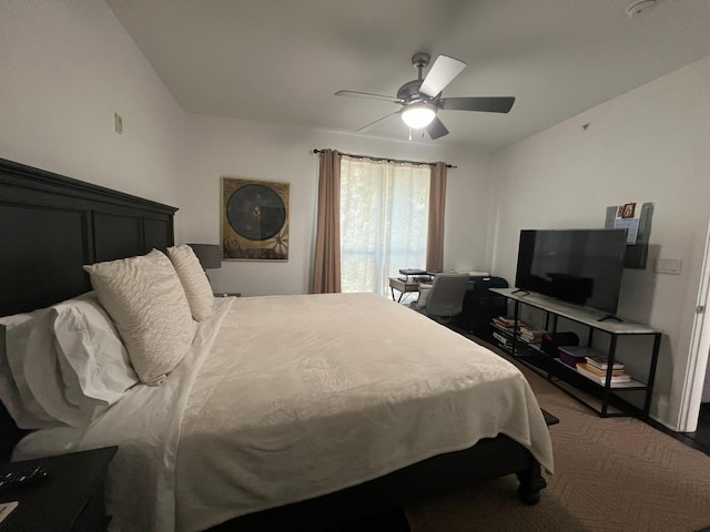 bedroom with lofted ceiling and a ceiling fan