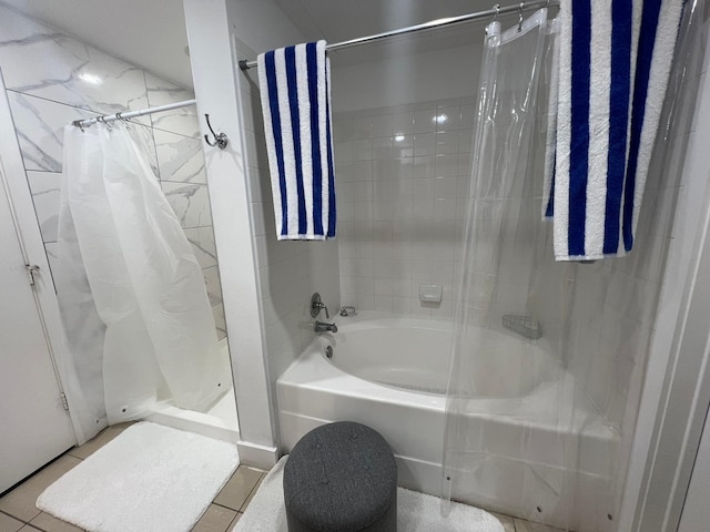 full bath with shower / bathtub combination with curtain and tile patterned floors