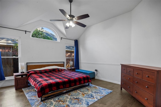 bedroom featuring vaulted ceiling, ceiling fan, wood finished floors, and baseboards